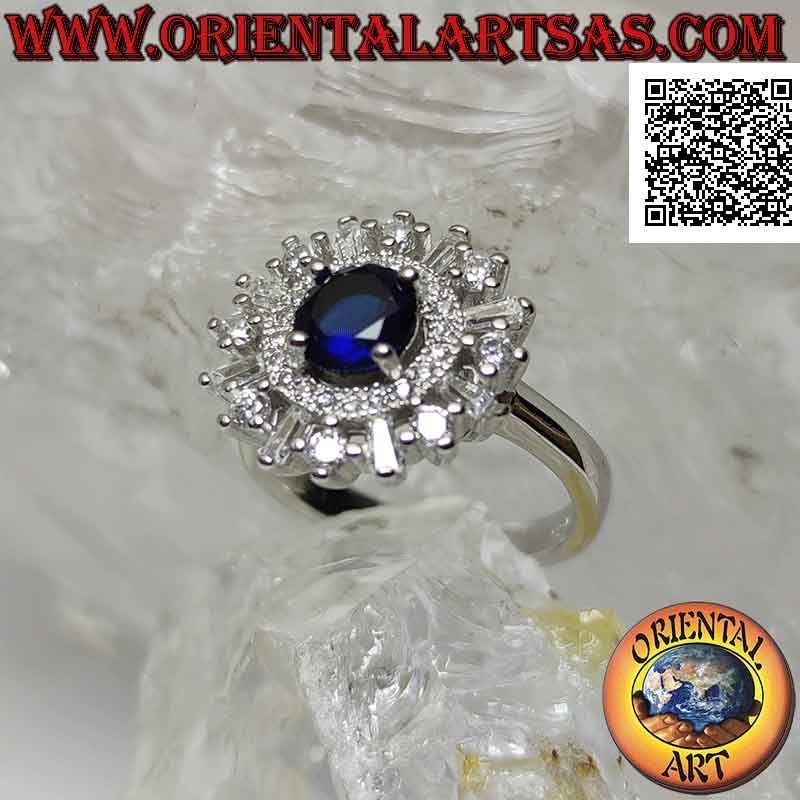 Silver ring with round synthetic sapphire set surrounded by a band and round and baguette zircons