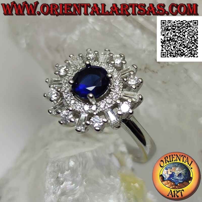 Silver ring with round synthetic sapphire set surrounded by a band and round and baguette zircons