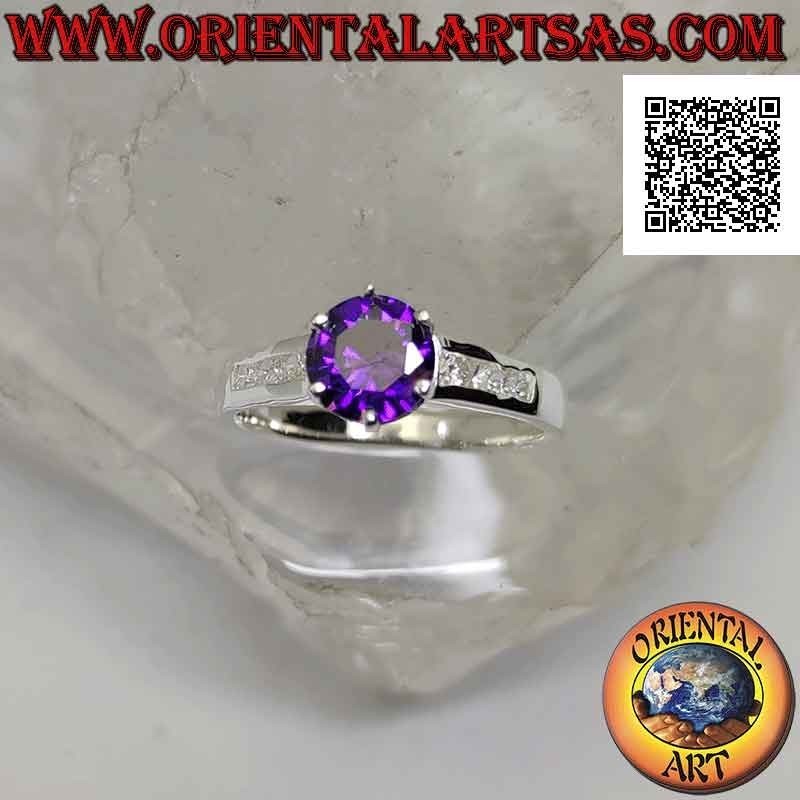 Silver ring with round synthetic amethyst set with white zircons on the sides