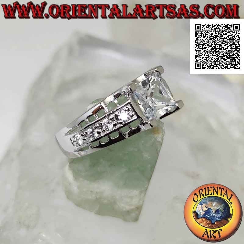 Silver ring with white square zircon set raised with white zircons and openwork on the sides