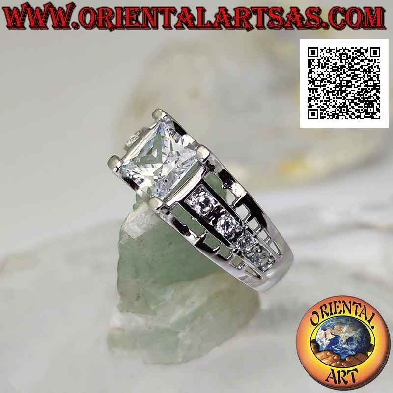 Silver ring with white square zircon set raised with white zircons and openwork on the sides
