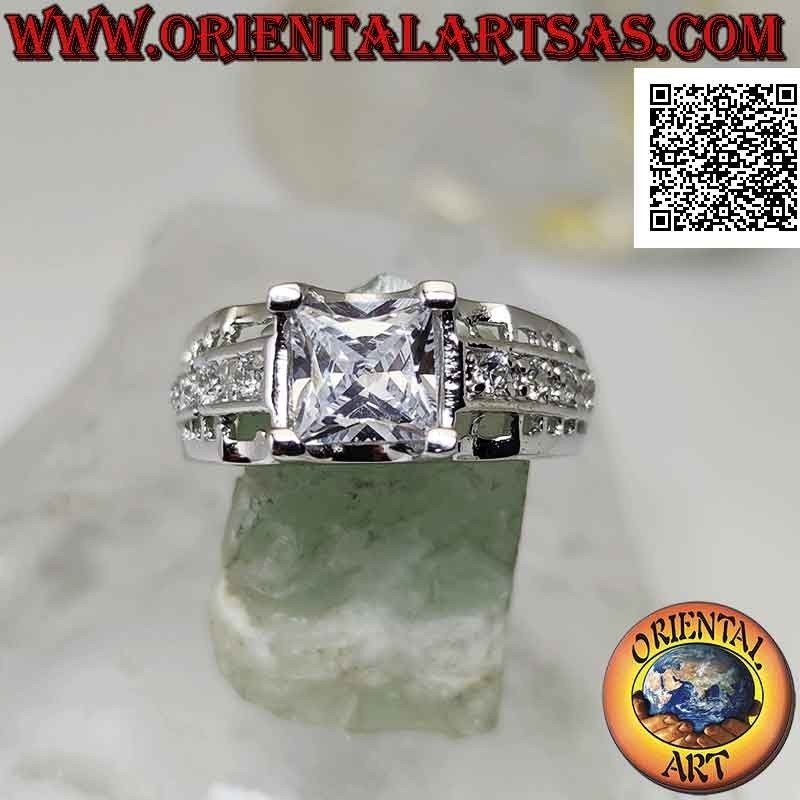 Silver ring with white square zircon set raised with white zircons and openwork on the sides