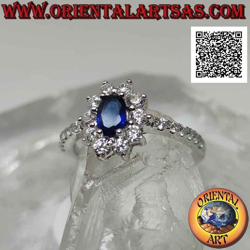 Silberring mit weißer Cubic Zirkonia Blume besetzt mit ovalem synthetischem Saphir und Cubic Zirkonia an den Seiten