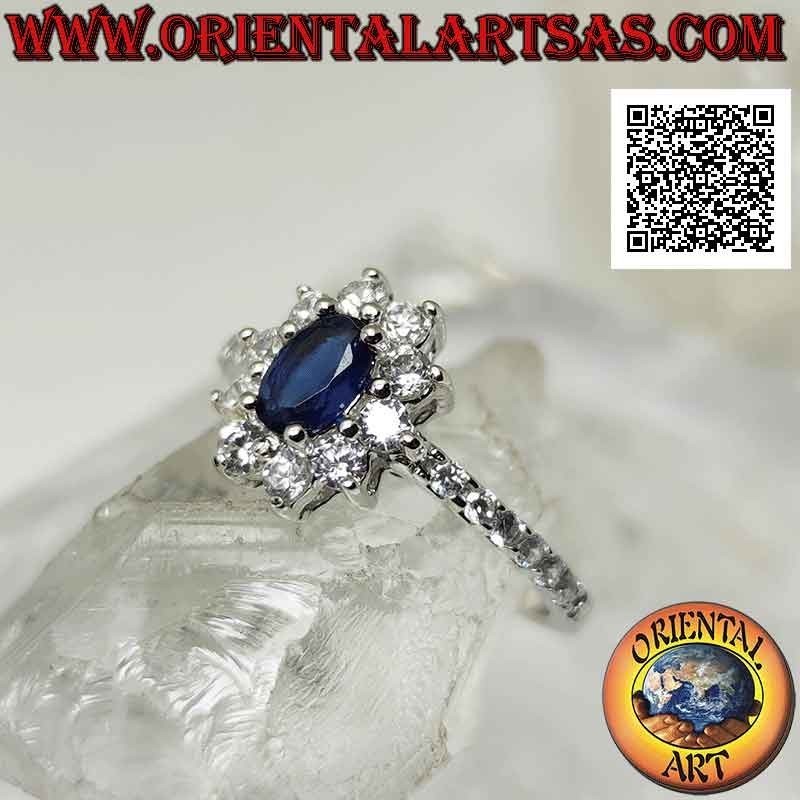 Silberring mit weißer Cubic Zirkonia Blume besetzt mit ovalem synthetischem Saphir und Cubic Zirkonia an den Seiten