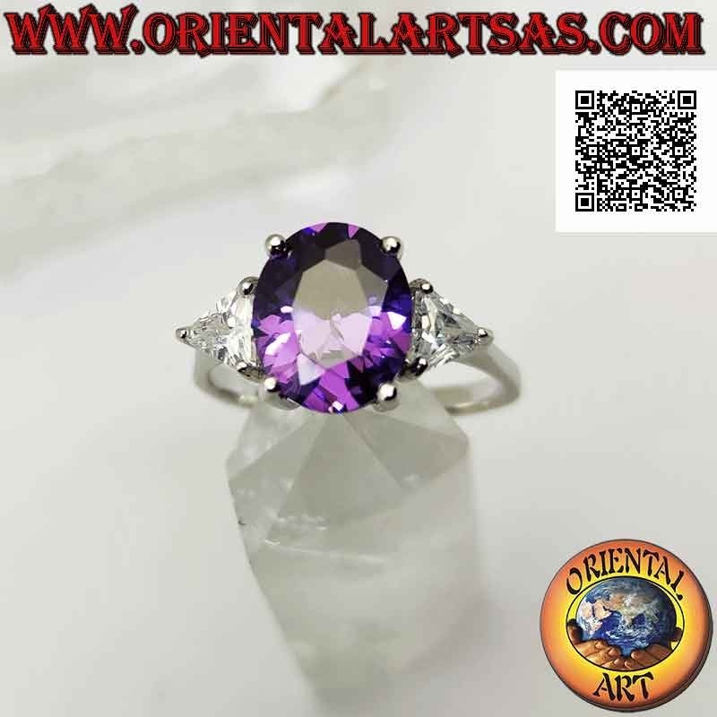 Silver ring with oval synthetic amethyst set between two triangles of white zircons