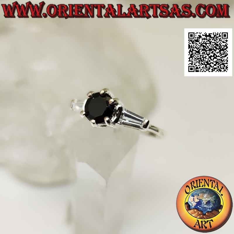 Silver ring with spinel set between two white trapezoid zircons