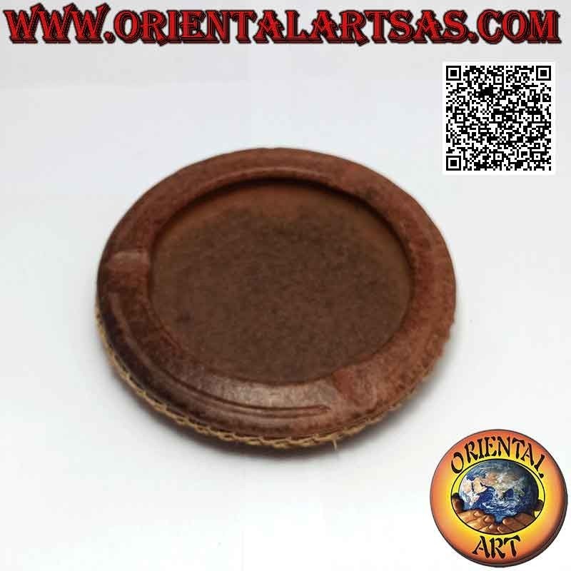 Round ashtray with woven wicker decoration, traditional of Lombok in terracotta