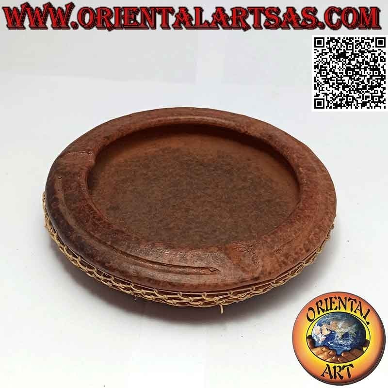 Round ashtray with woven wicker decoration, traditional of Lombok in terracotta