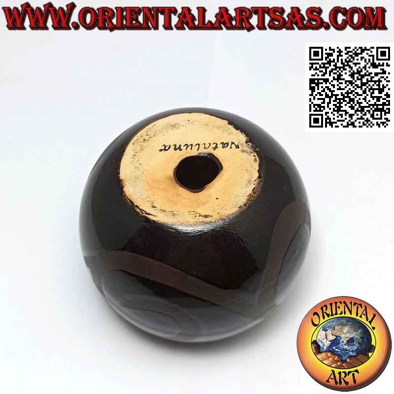 Spherical candle holder with ceramic candle