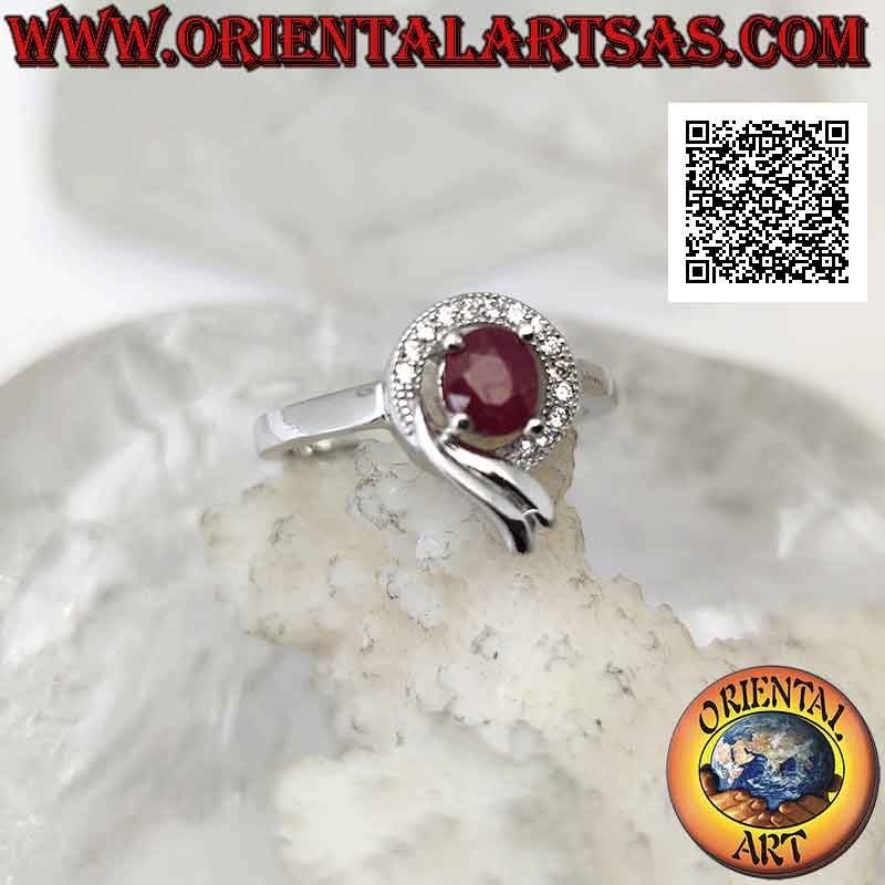 Silver ring with oval synthetic ruby set wrapped in a line of white and smooth zircons