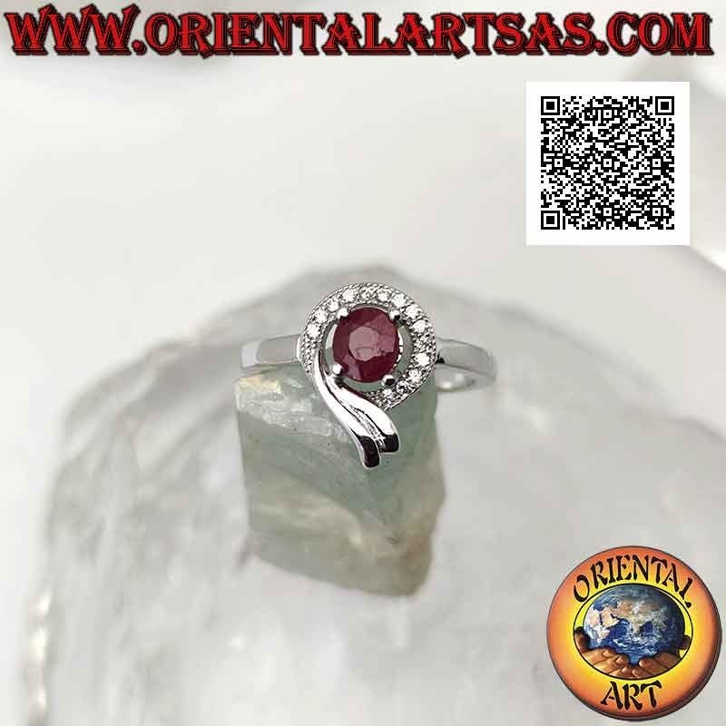 Silver ring with oval synthetic ruby set wrapped in a line of white and smooth zircons