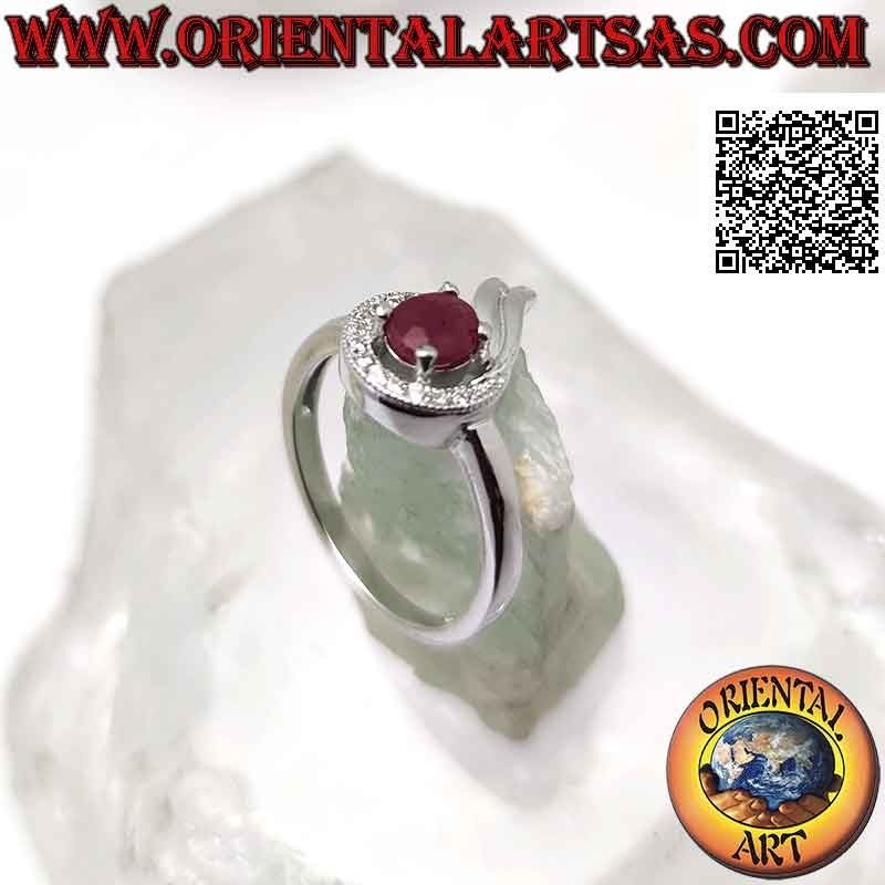 Silver ring with oval synthetic ruby set wrapped in a line of white and smooth zircons