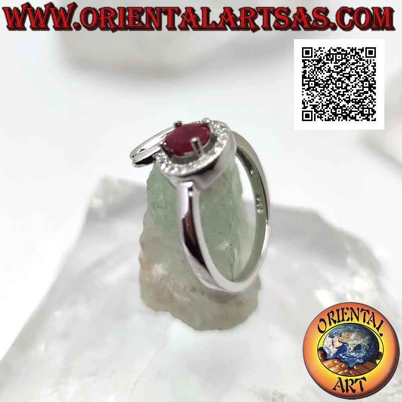 Silver ring with oval synthetic ruby set wrapped in a line of white and smooth zircons