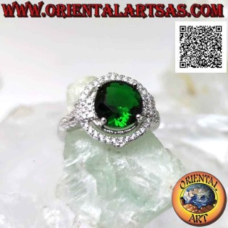 Silver ring with round synthetic emerald set surrounded by zircons with relief on the cardinal points