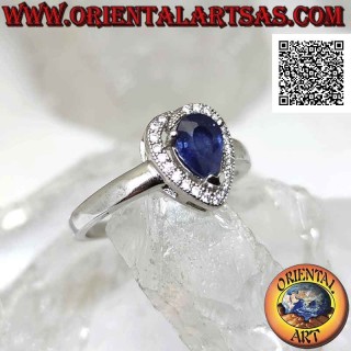 Silver ring with synthetic teardrop sapphire set surrounded by zircons with superimposed terminal