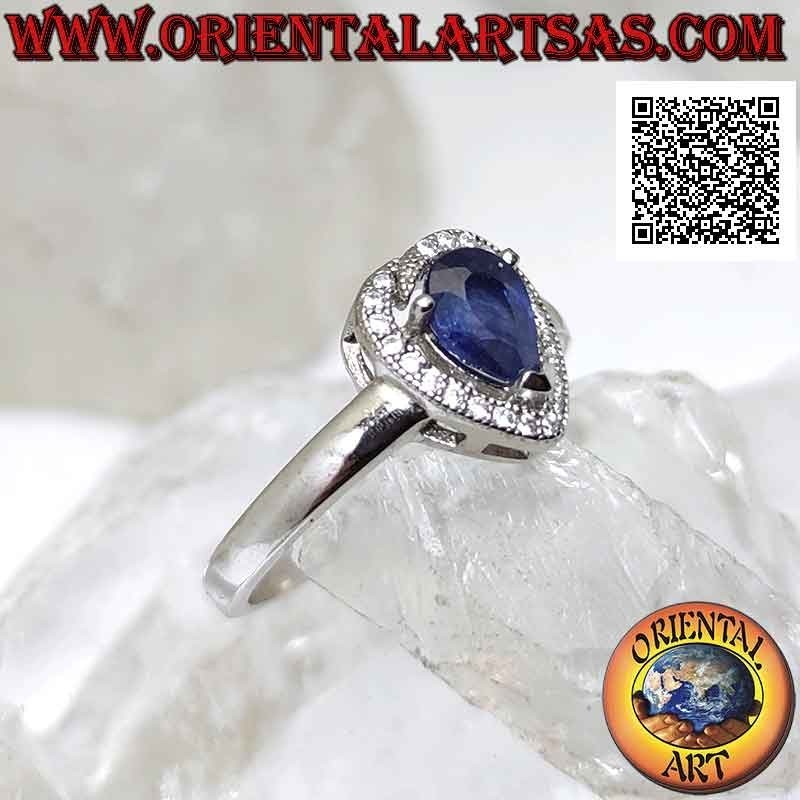 Silver ring with synthetic teardrop sapphire set surrounded by zircons with superimposed terminal