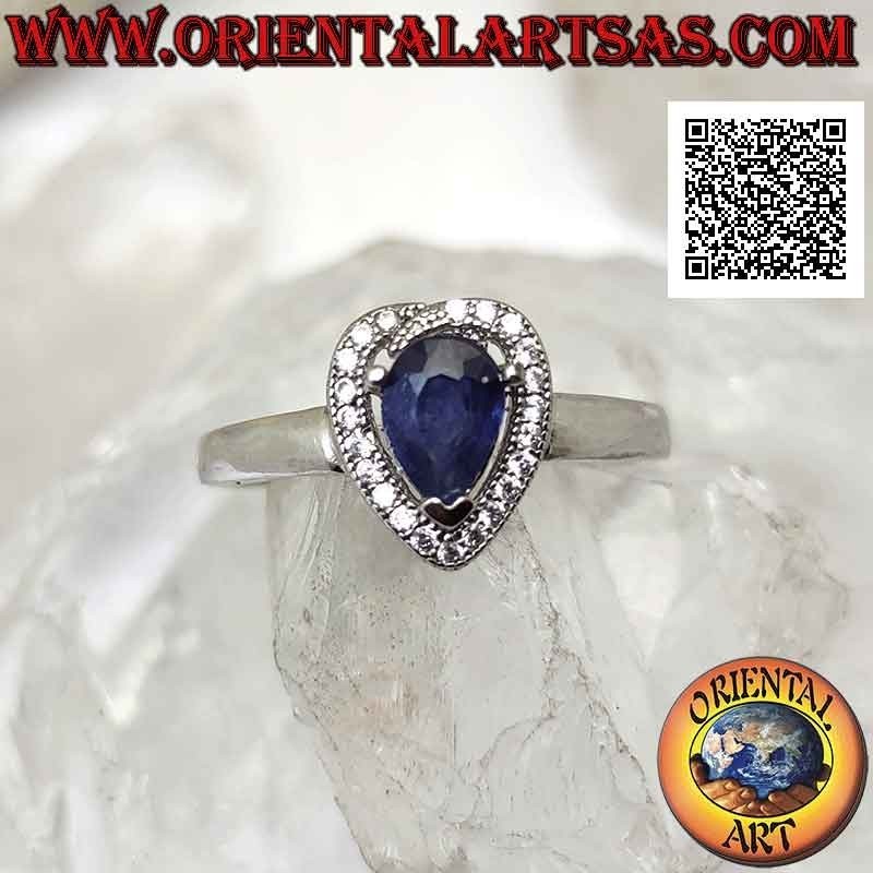 Silver ring with synthetic teardrop sapphire set surrounded by zircons with superimposed terminal
