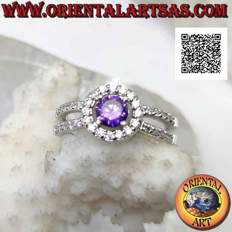 Silver ring with natural round amethyst set surrounded by xircons and hooked to two