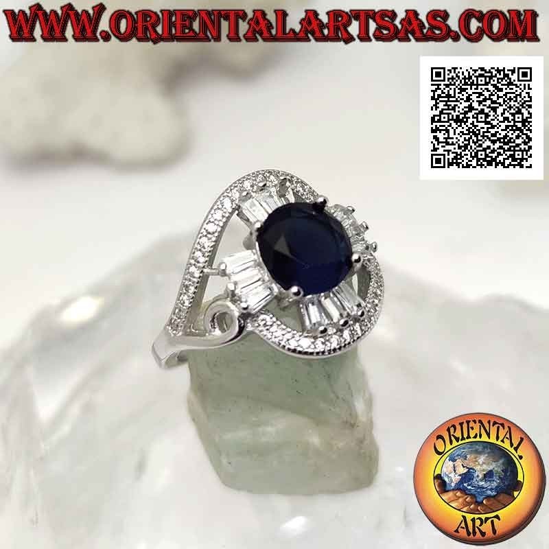 Anello in argento con zaffiro di sintesi tondo incastonato su croce di zirconi bianchi a taglio baguette