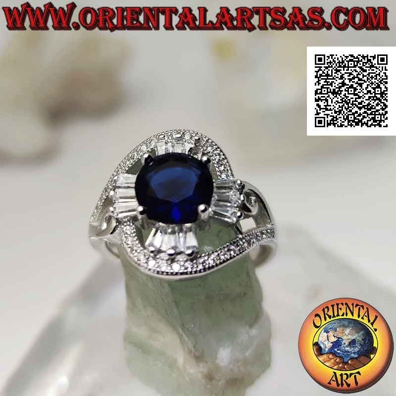 Silver ring with round synthetic sapphire set on a cross of baguette-cut white zircons