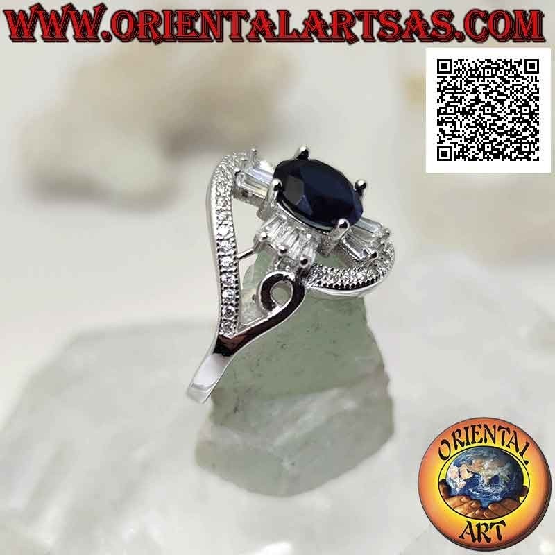 Silver ring with round synthetic sapphire set on a cross of baguette-cut white zircons