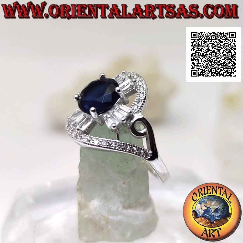 Silver ring with round synthetic sapphire set on a cross of baguette-cut white zircons