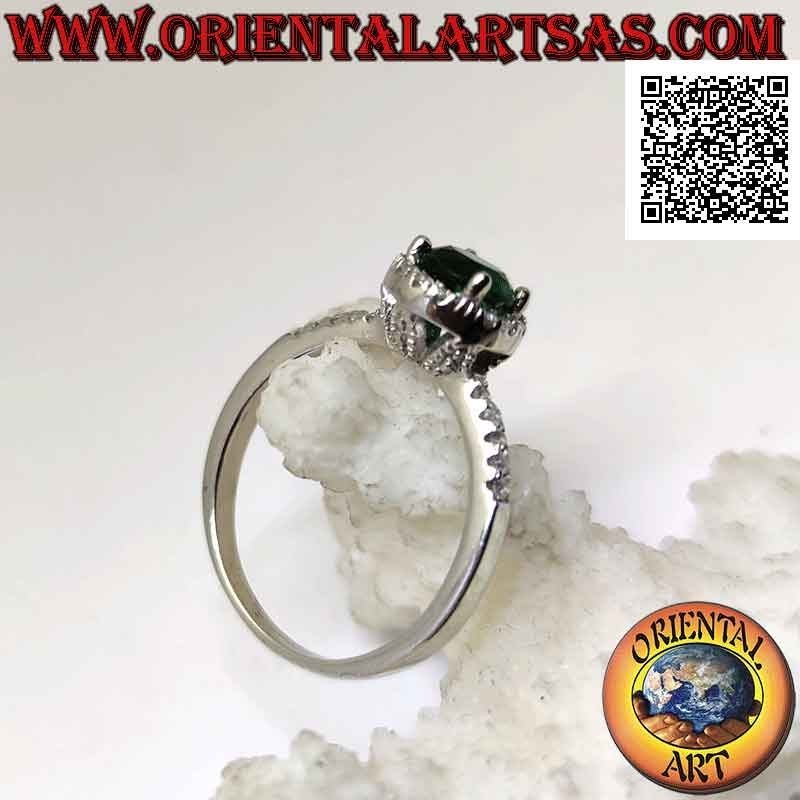 Silver ring with round synthetic emerald set surrounded by white zircons and on the sides