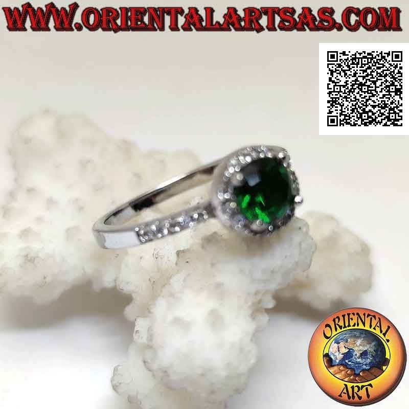 Silver ring with round synthetic emerald set surrounded by white zircons and on the sides