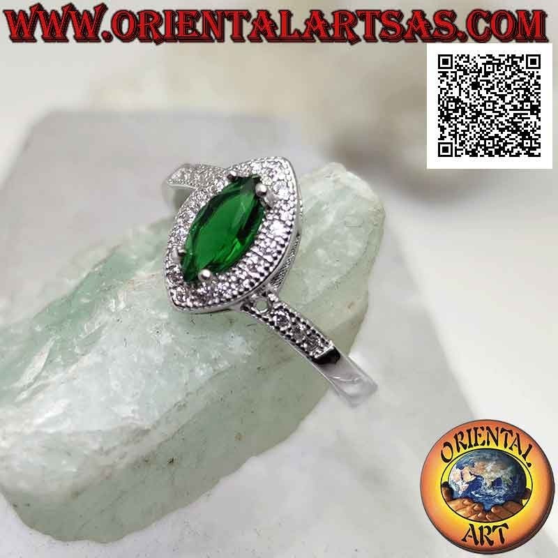 Silver ring with synthetic shuttle emerald set surrounded by white zircons and on the sides