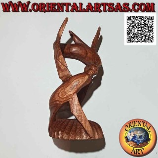 Bottle holder sculpture of a couple of spiral dolphins in an enveloping game in suar wood