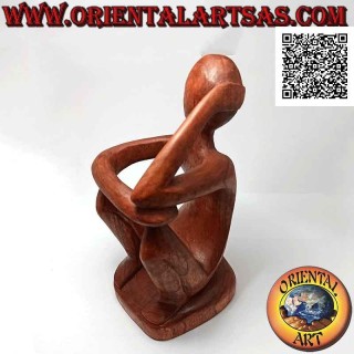 Portabottiglie scultura di un pensatore seduto in riflessione in legno di Suar