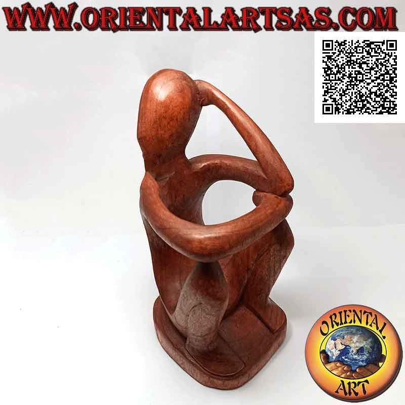 Bottle holder sculpture of a seated thinker in reflection in Suar wood