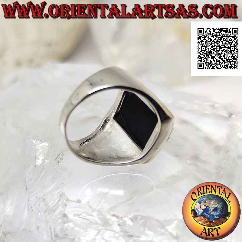 Silver ring with faceted rounded rectangular onyx on smooth frame with raised dial