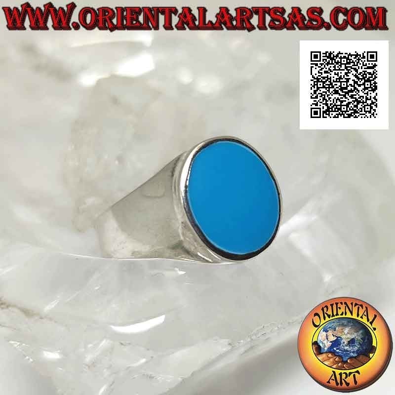 Silver ring with oval turquoise flush with slightly raised edge on a smooth frame