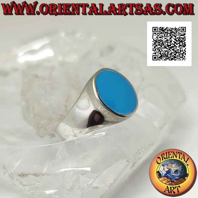 Anillo de plata con turquesa ovalada al ras con borde ligeramente levantado sobre marco liso