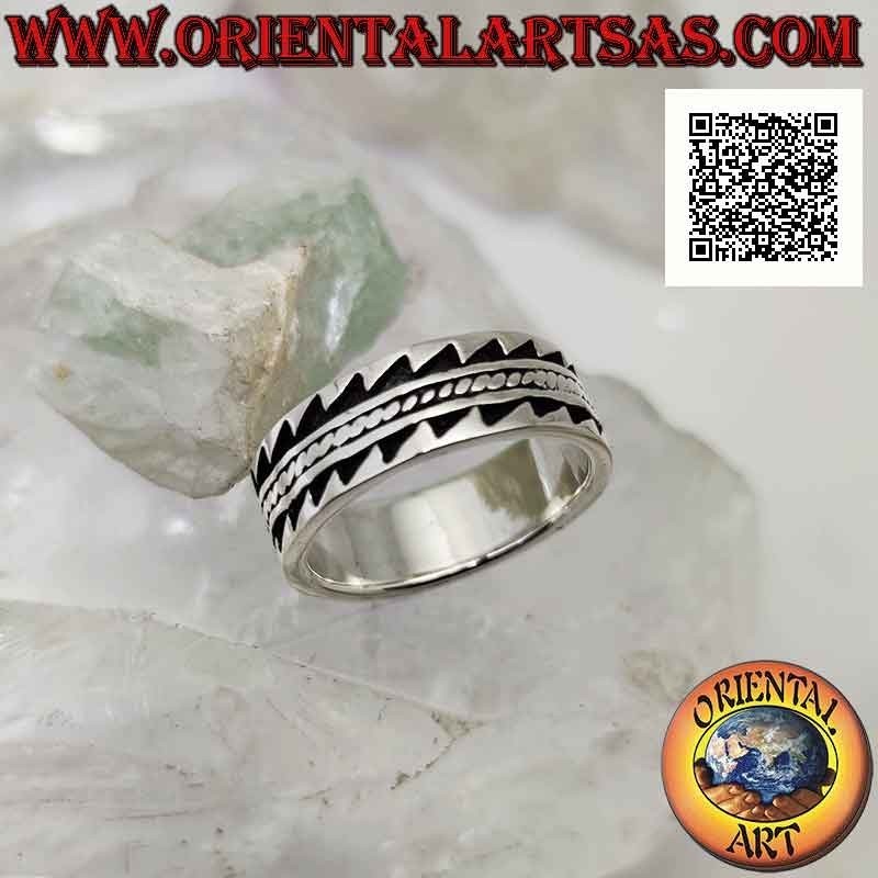 Silver ring with worked band with toothed bas-relief decoration