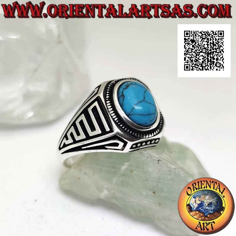 Silver ring with oval cabochon turquoise and waves in bas-relief on the sides