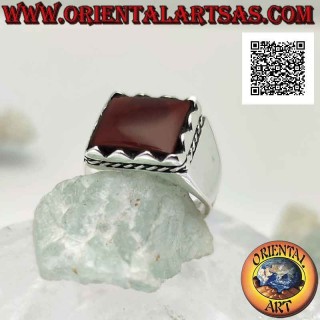 Silver ring with raised rectangular framed carnelian and side cord