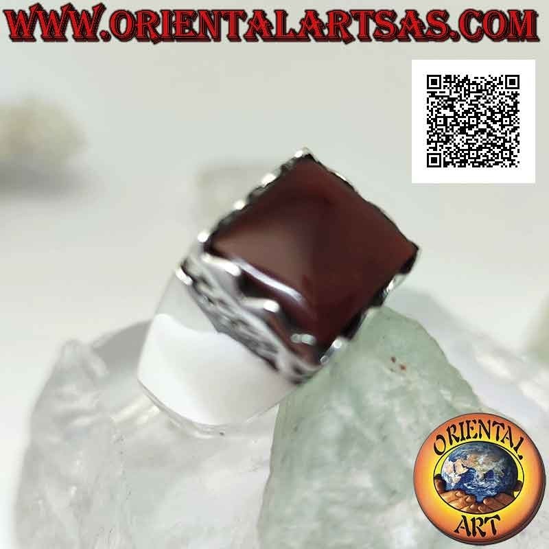 Silver ring with raised rectangular framed carnelian and side cord