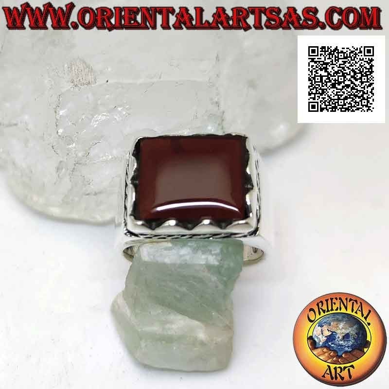 Silver ring with raised rectangular framed carnelian and side cord
