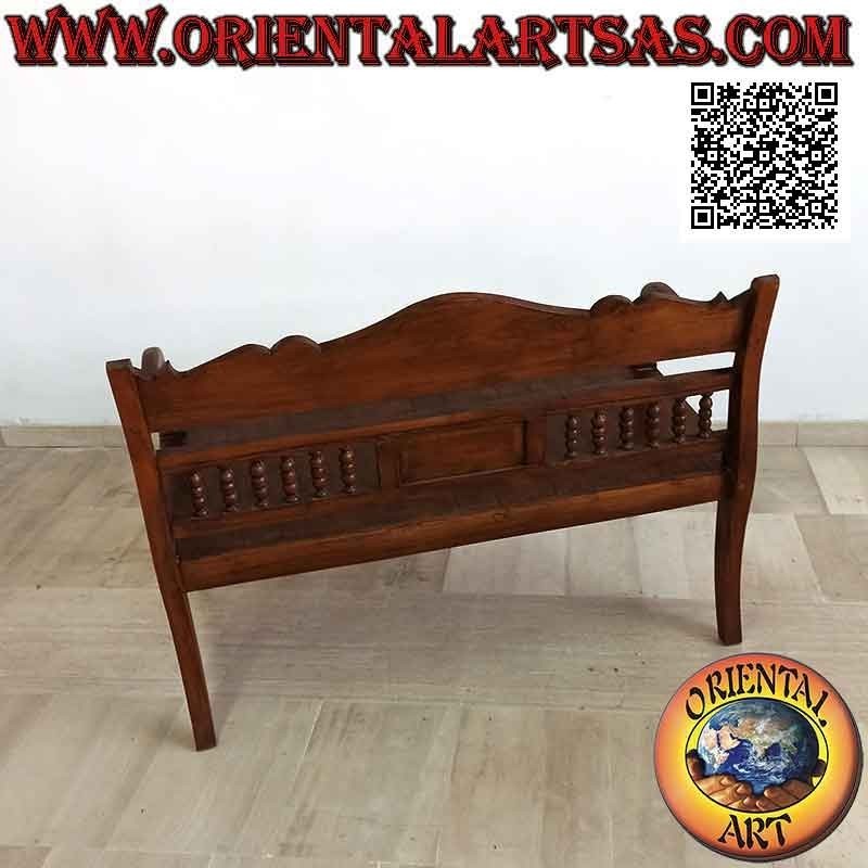 Two-seater bench with column back and hand-carved crown in antique teak wood