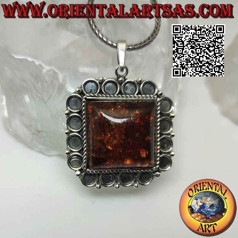 Silver pendant with large square Baltic amber with bas-relief circle frame