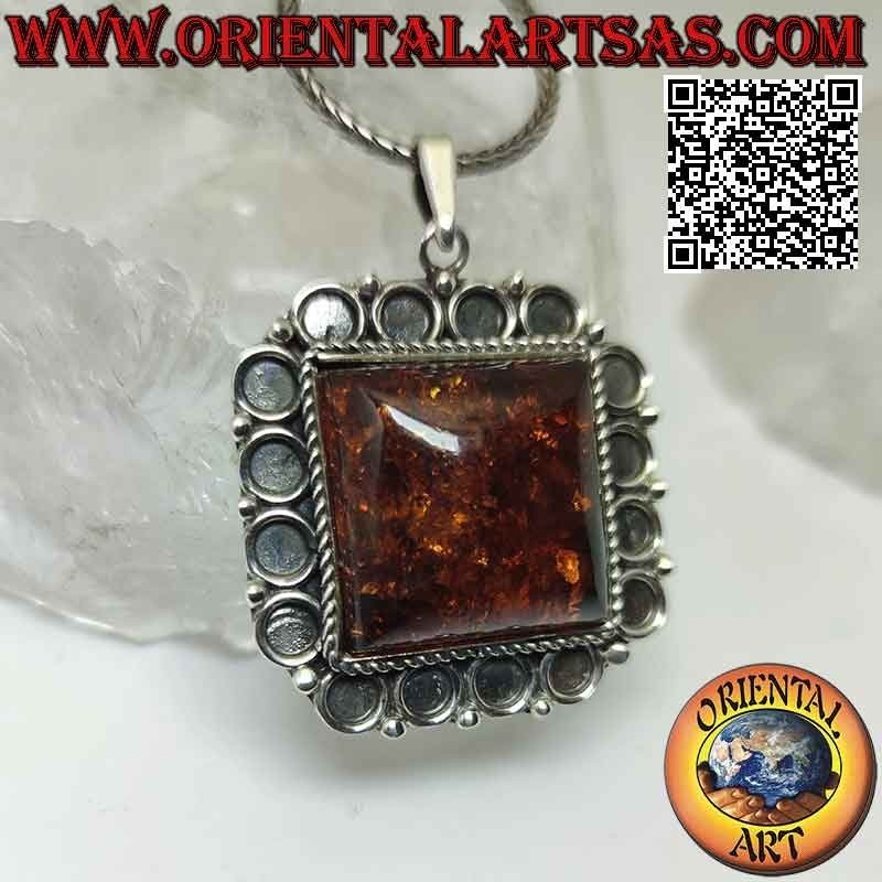 Silver pendant with large square Baltic amber with bas-relief circle frame