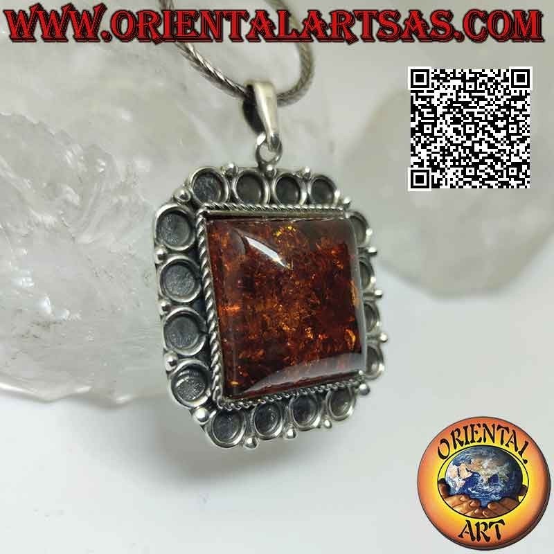 Silver pendant with large square Baltic amber with bas-relief circle frame
