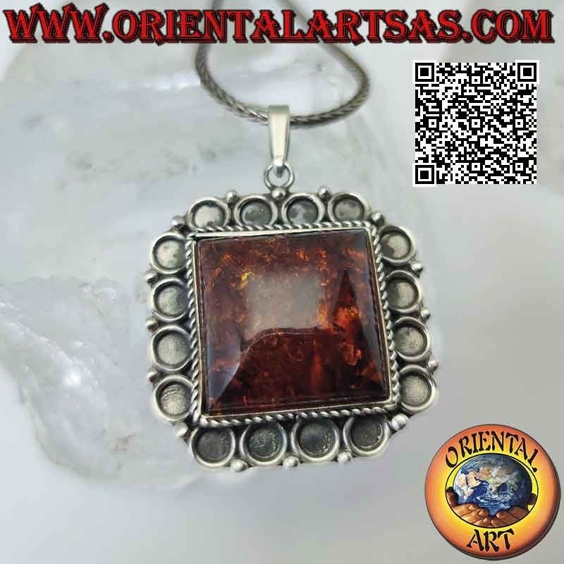 Silver pendant with large square Baltic amber with bas-relief circle frame