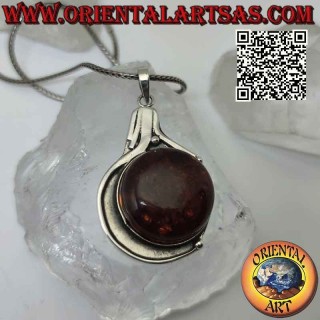 Silver pendant with large round Baltic amber on a smooth bas-relief setting