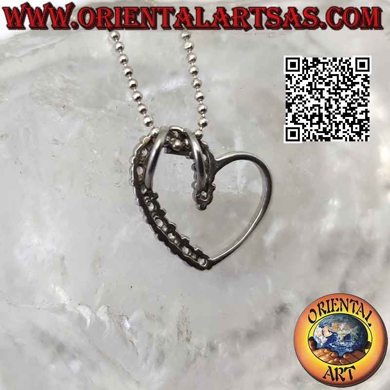 Silver pendant, contour of a linear heart half studded with zircons