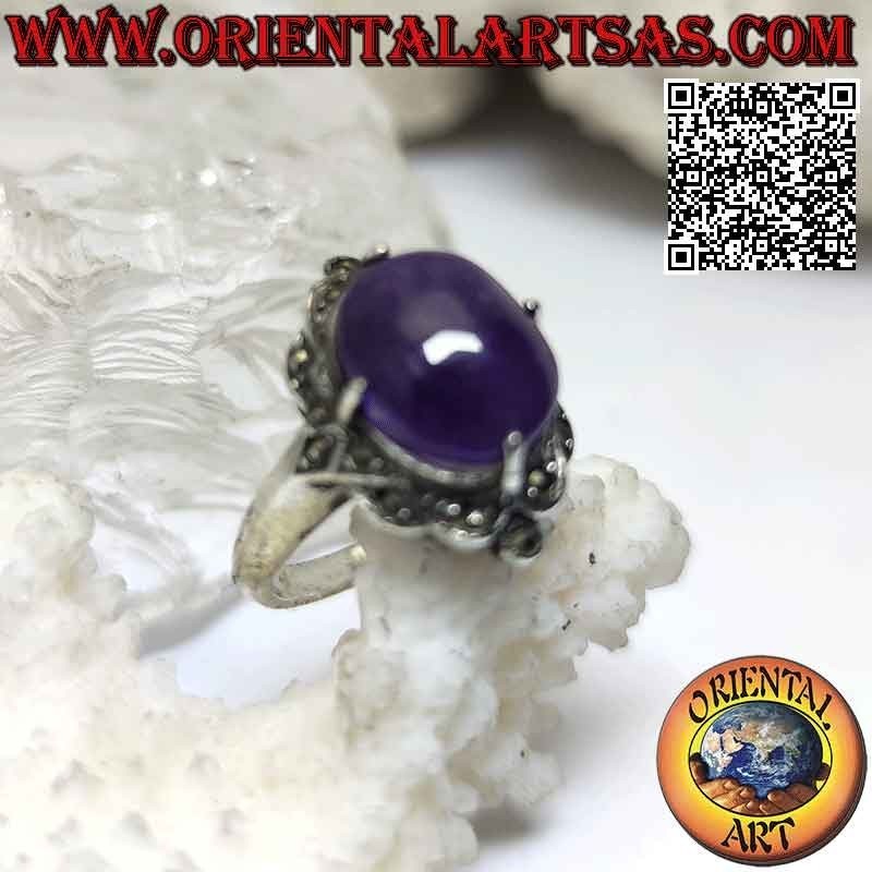 Silver ring with cabochon oval amethyst set in a marcasite-studded setting