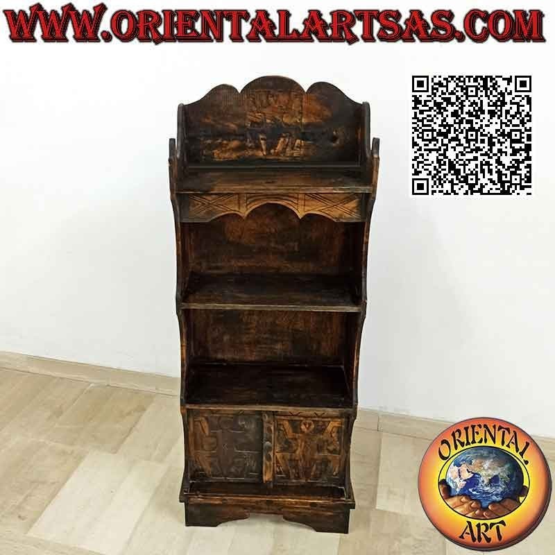 Small bookcase with three shelves and two doors with indigenous figures carved in balsa wood (130x50x23)