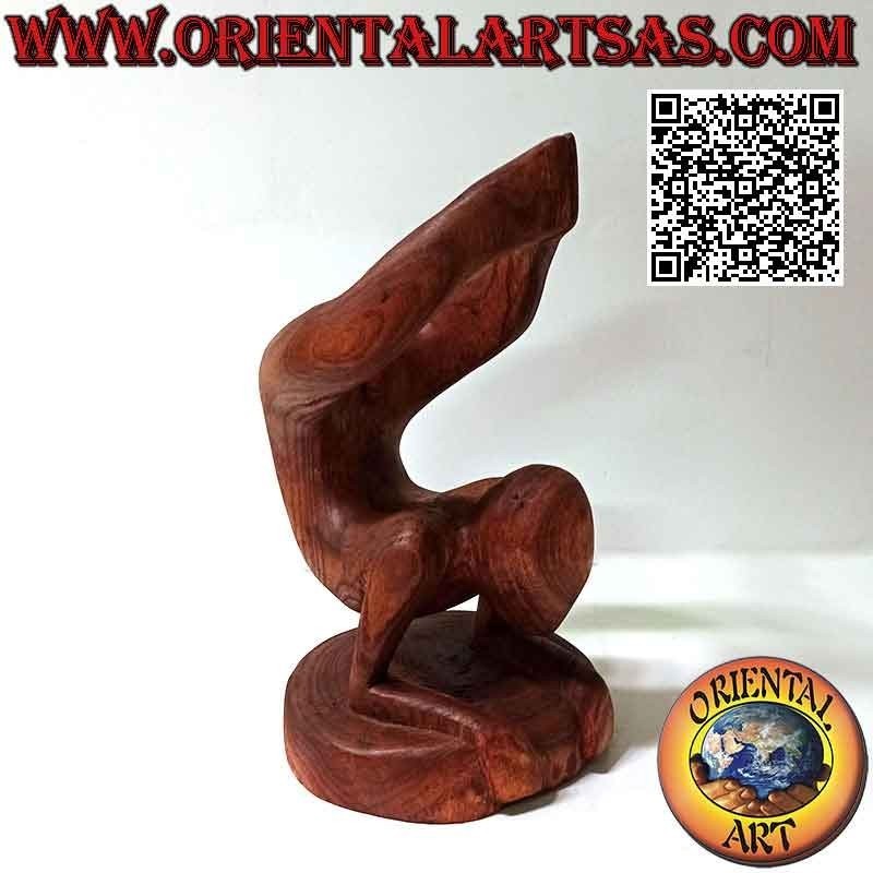 Portabottiglie scultura di un acrobata in posizione artistica in legno di Suar